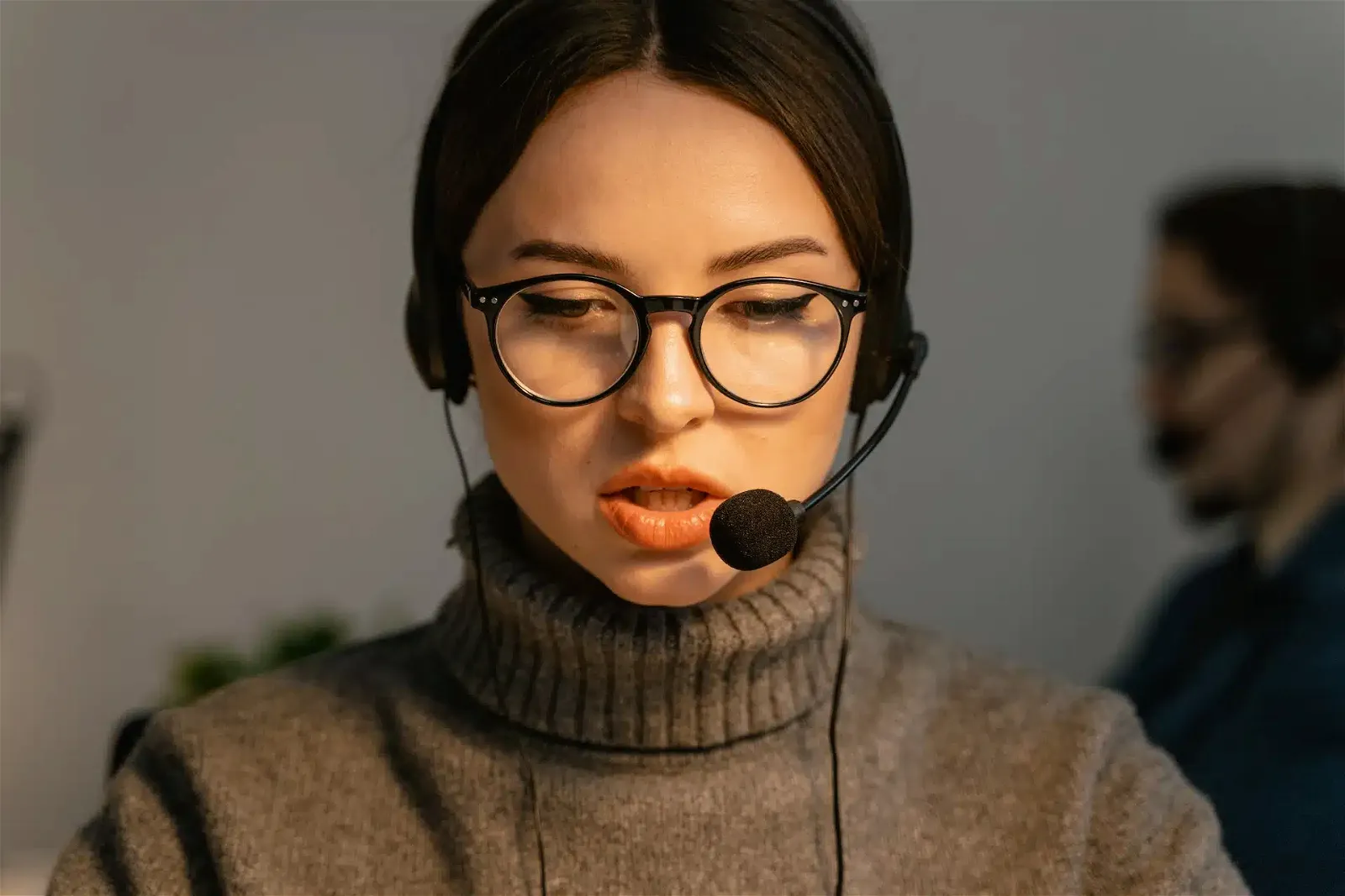 A Woman Wearing Headphones while Working